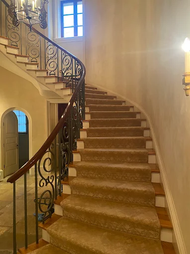 Cleaned carpet runner on a grand curved staircase